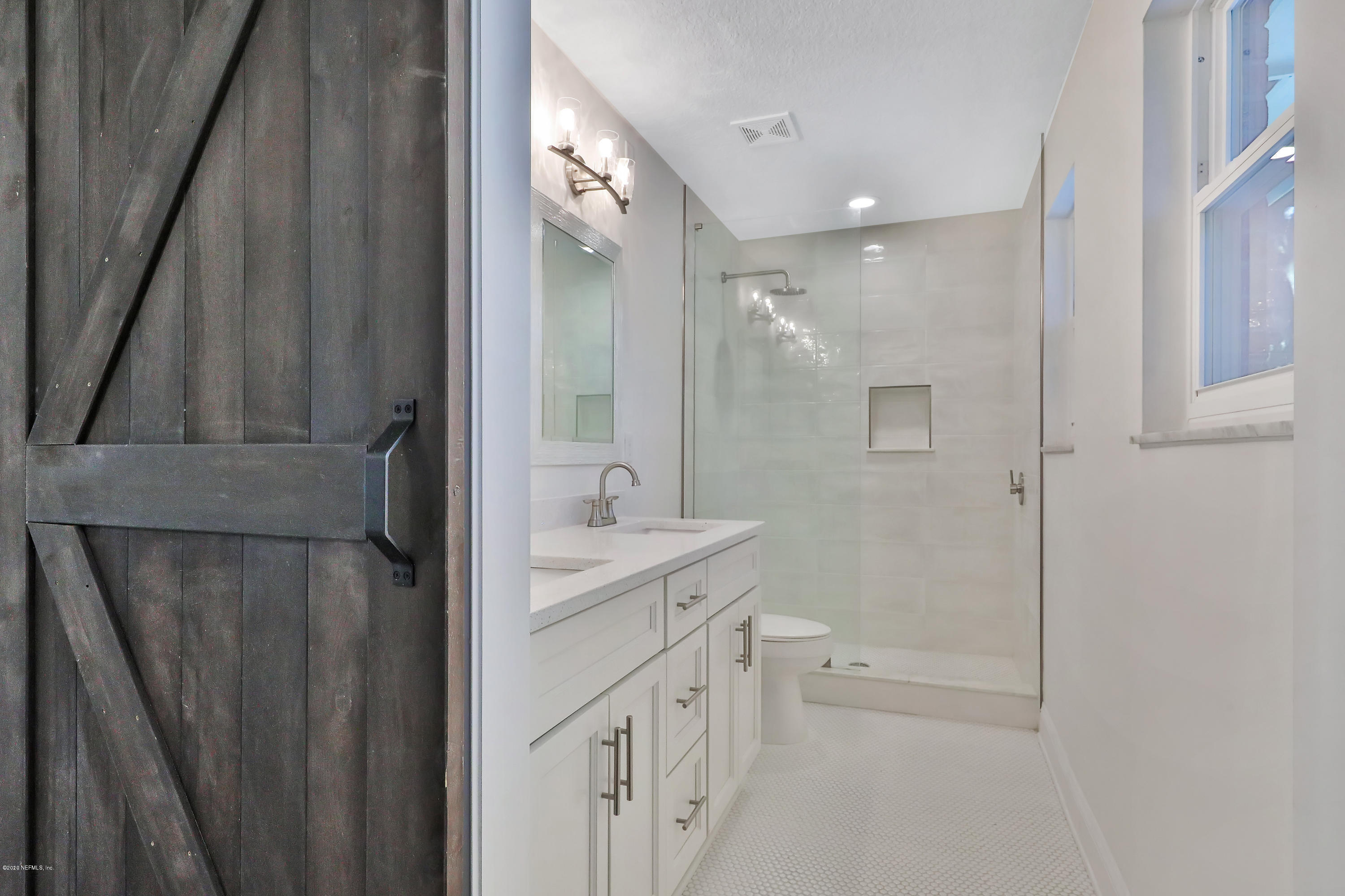 4603 Morris Road Jacksonville, FL 32225 - Photo 19 of 33 Barn doors leading to Master Bath