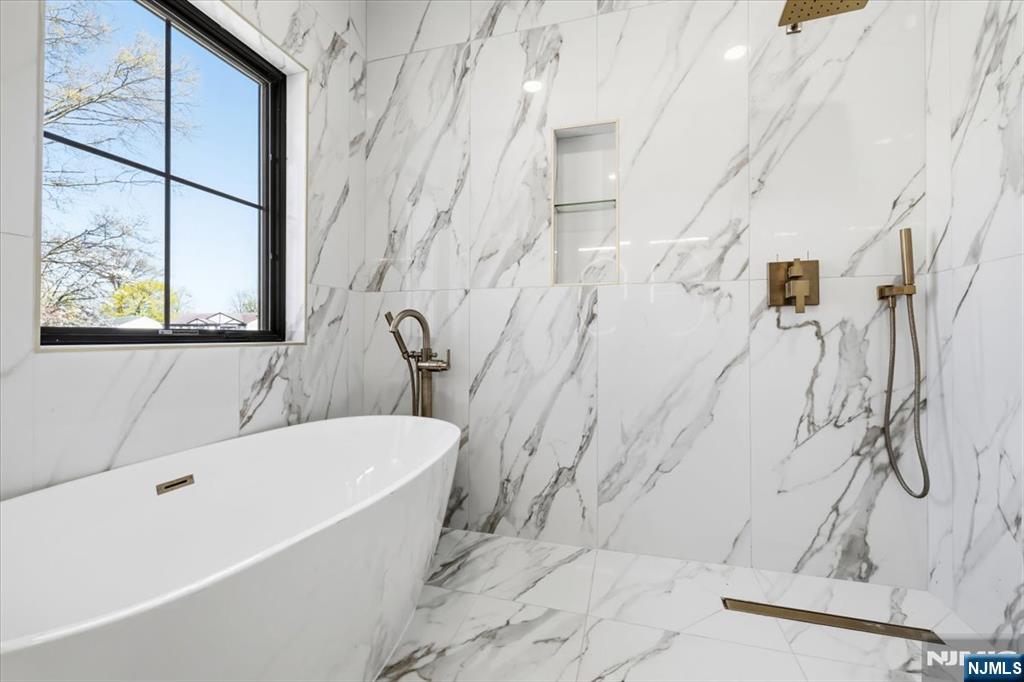 150 Howland Avenue River Edge, NJ 07661 - Photo 18 of 45 a bathroom with a bathtub and shower