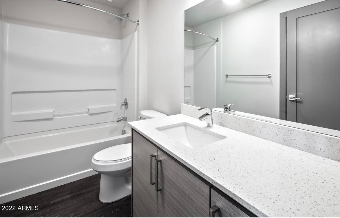 425 West Osborn Road, Unit 205 Phoenix, AZ 85013 - Photo 8 of 29 a bathroom with a sink toilet and shower
