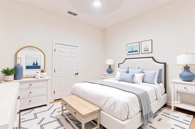 a bedroom with a bed and a dresser