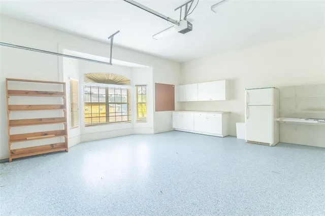 a view of a room with cabinet and windows