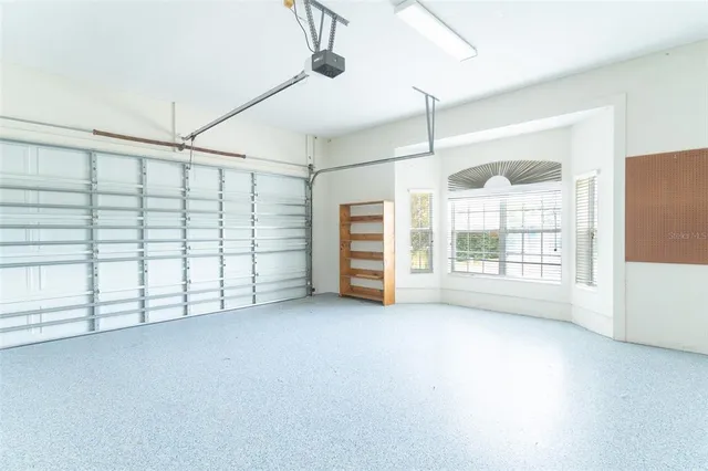 a view of a big room with windows and wardrobe
