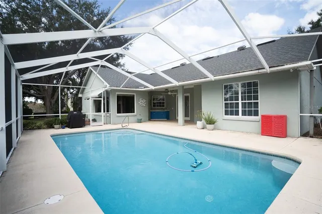 a view of a house with pool and porch