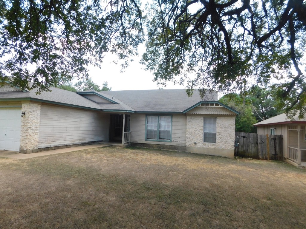a front view of a house with a garage