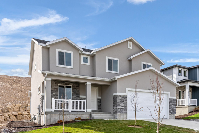387 Slant Road, Unit 30 Spanish Fork, UT 84660 - Photo 3 of 25 Modern two-story residence featuring a stucco exterior with stone veneer accents