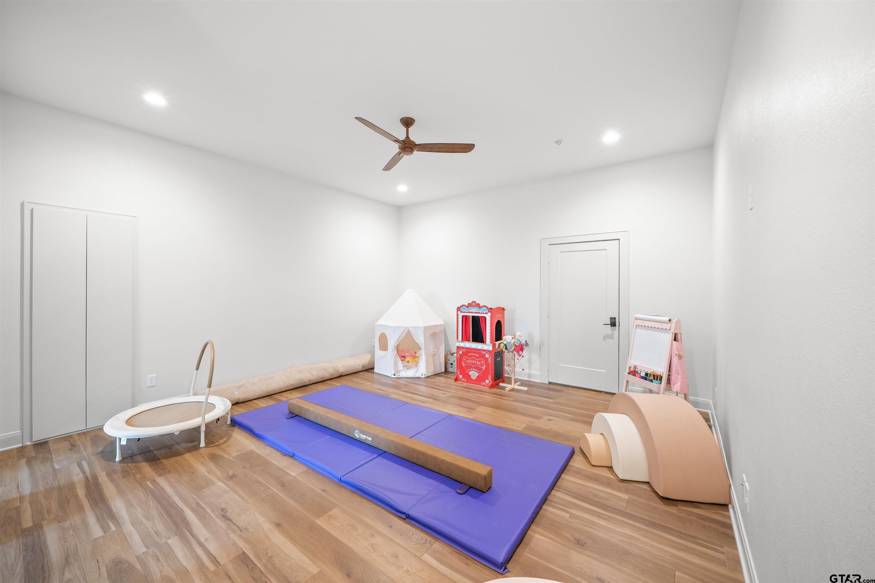1555 Chaparrel Run Tyler, TX 75703 - Photo 32 of 48 a bedroom with a bed and a chandelier