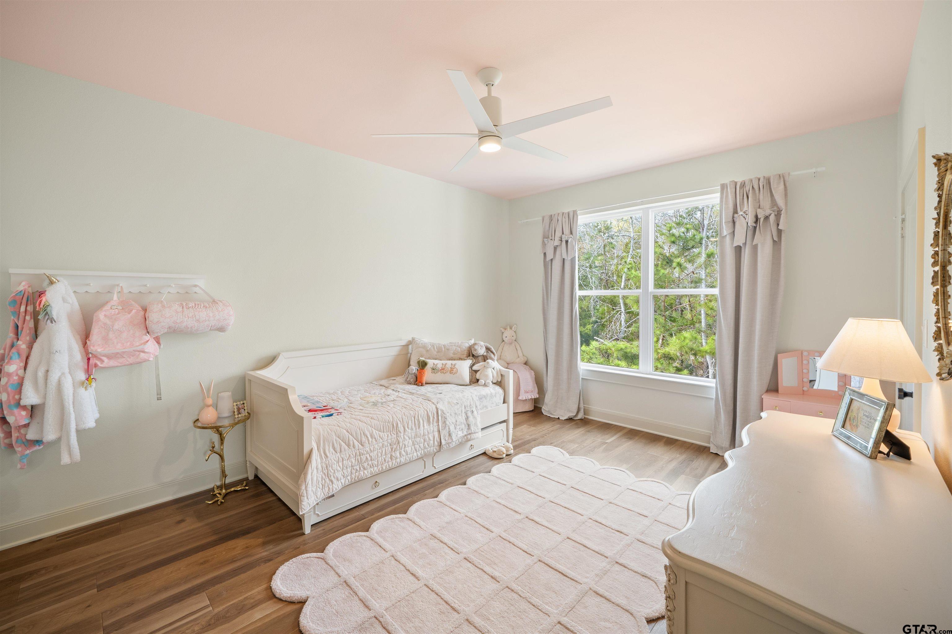 1555 Chaparrel Run Tyler, TX 75703 - Photo 40 of 48 a bed room with a bed and a chair