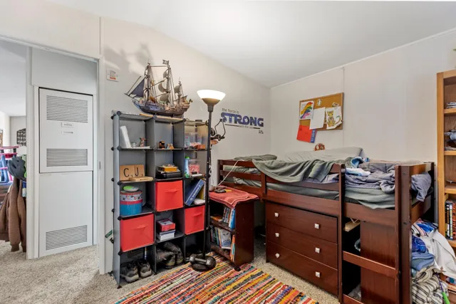 a bathroom with a sink a toilet and shower curtain