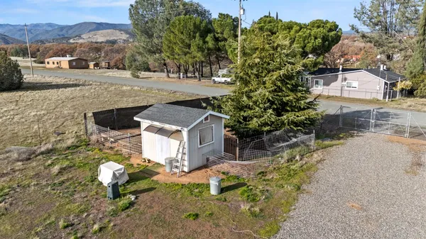 a swimming pool with trees in front of it