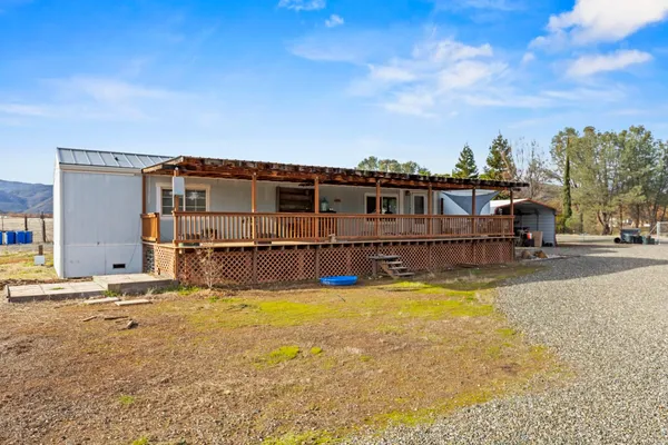 a view of a swimming pool with an outdoor seating