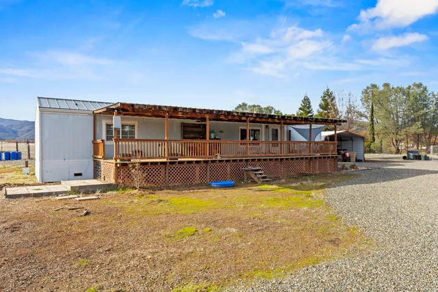 a view of a swimming pool with an outdoor seating