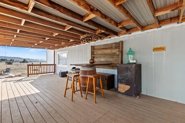 a view of hallway with wooden floor and stairs