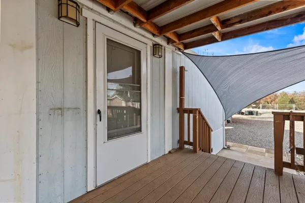 a view of hallway with paintings on the wall