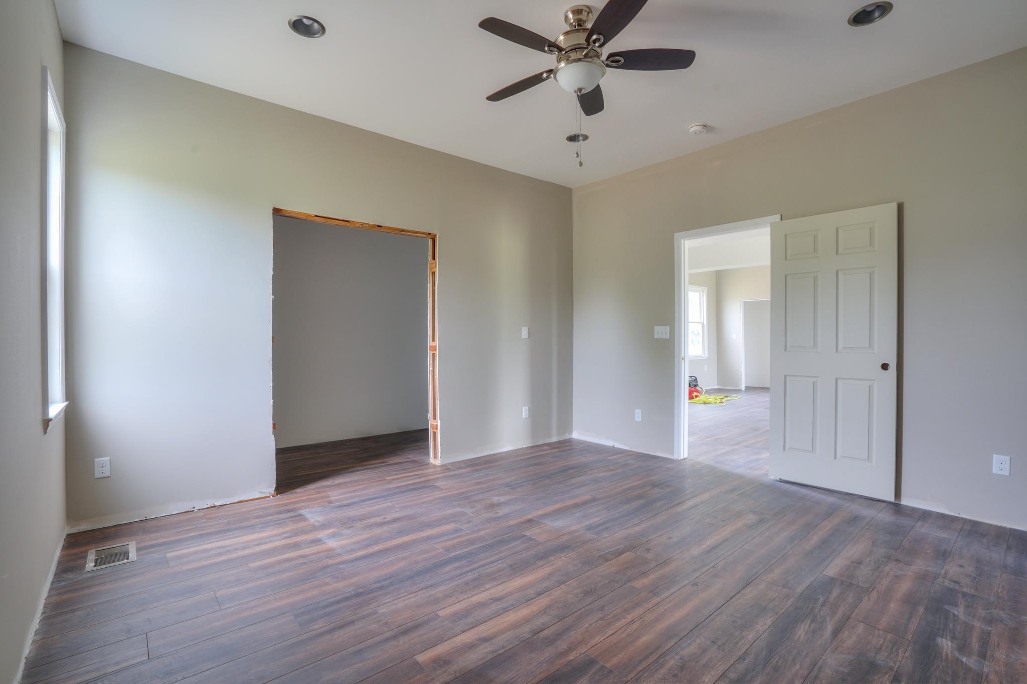 612 Murrell Road Dickson, TN 37055 - Photo 22 of 29 a view of an empty room with wooden floor