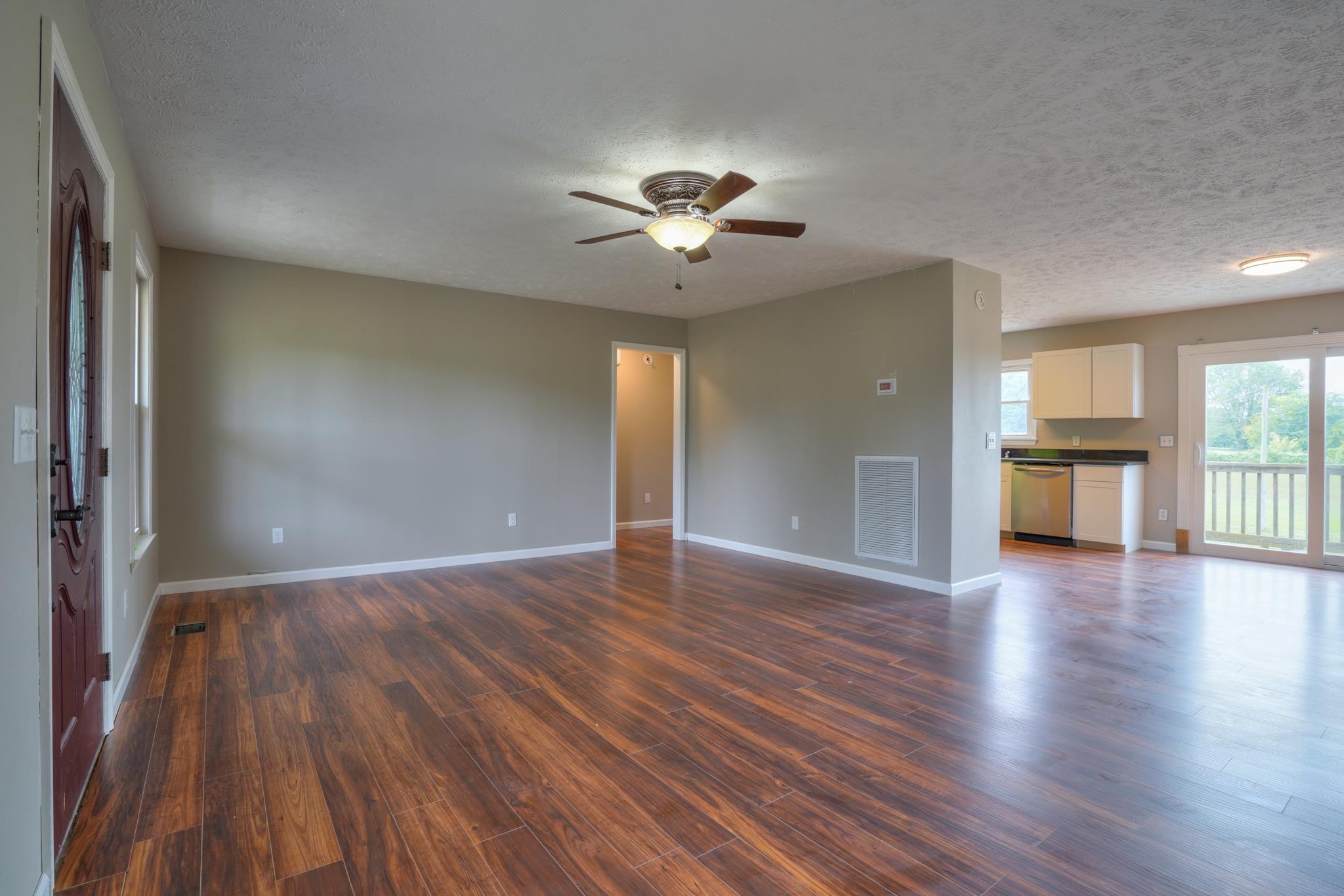 612 Murrell Road Dickson, TN 37055 - Photo 5 of 29 a view of empty room with wooden floor and fan