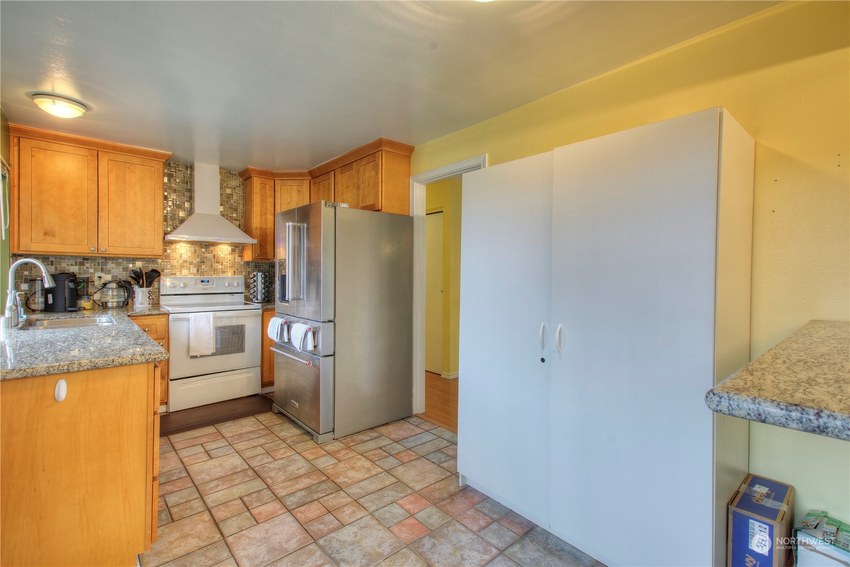 32607 35th Avenue Southwest Federal Way, WA 98023 - Photo 11 of 24 a kitchen with stainless steel appliances granite countertop a refrigerator and a stove