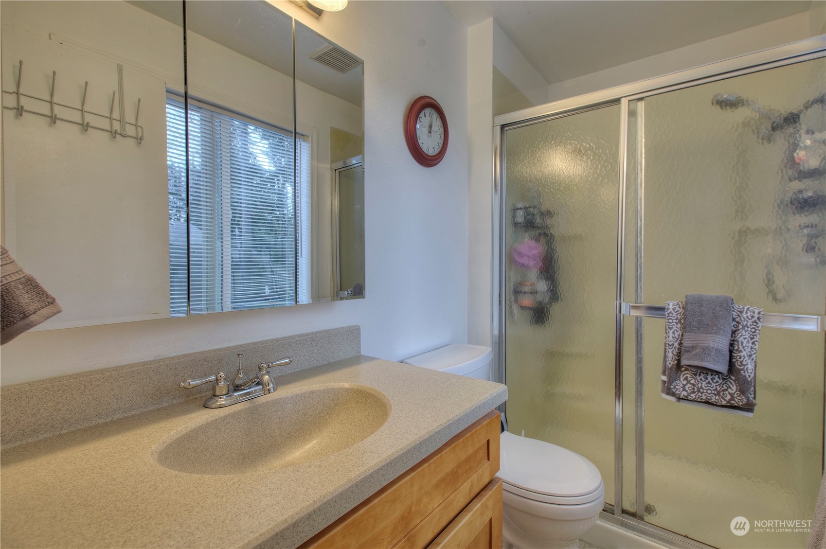 32607 35th Avenue Southwest Federal Way, WA 98023 - Photo 15 of 24 a bathroom with a sink a toilet a mirror and shower