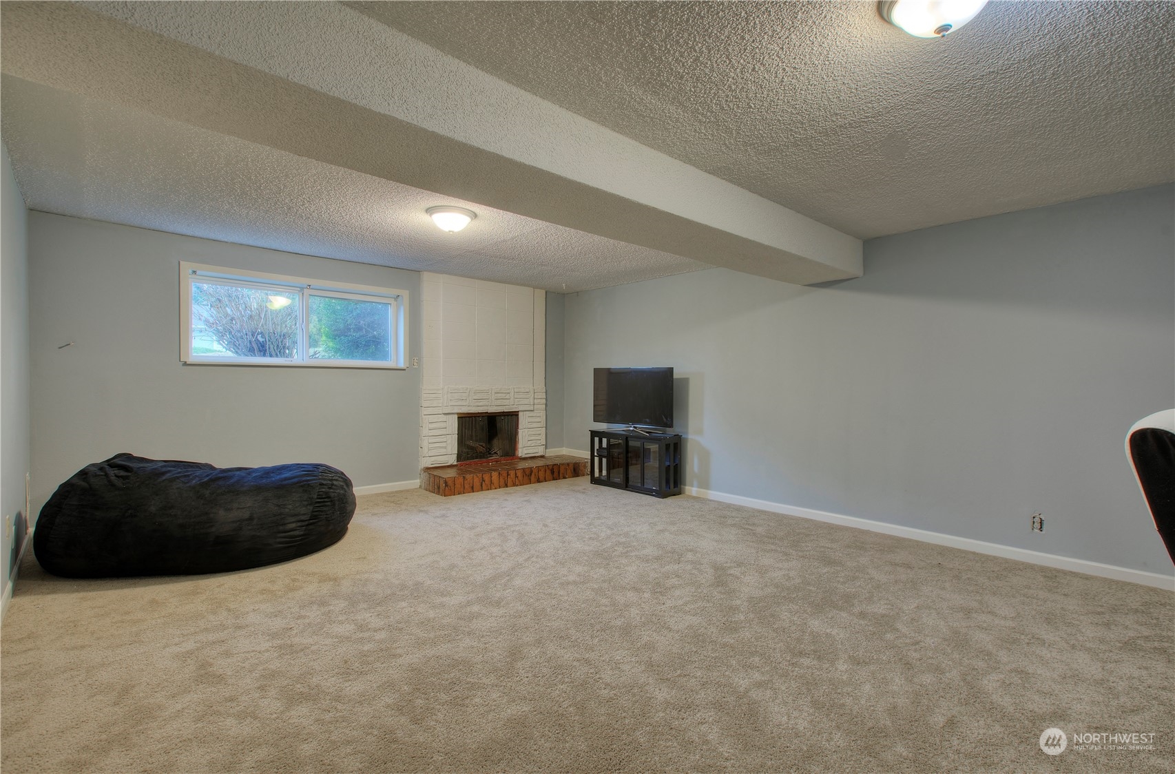32607 35th Avenue Southwest Federal Way, WA 98023 - Photo 18 of 24 a living room with furniture and a flat screen tv