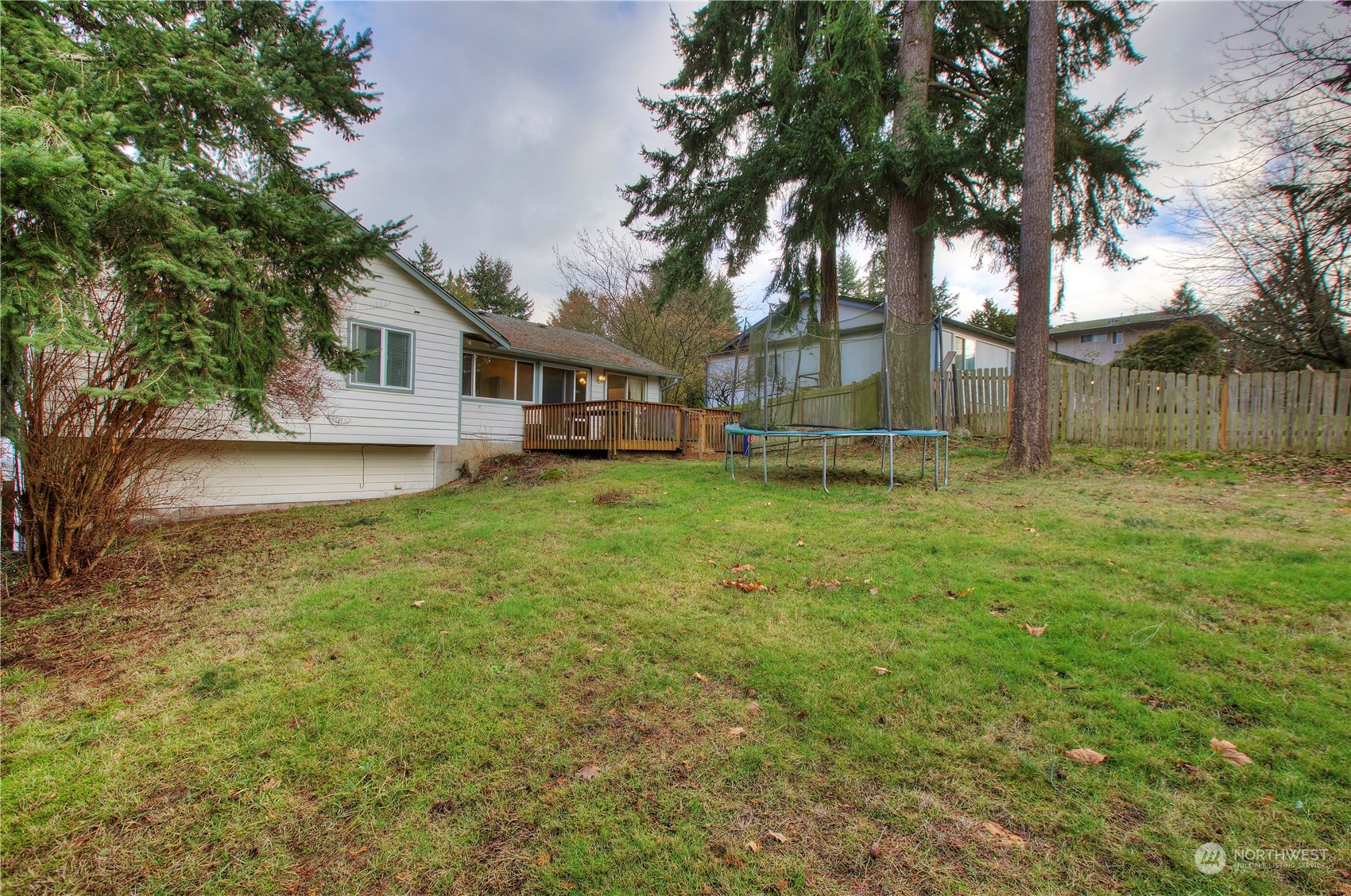 32607 35th Avenue Southwest Federal Way, WA 98023 - Photo 23 of 24 a view of a yard with a house and large trees