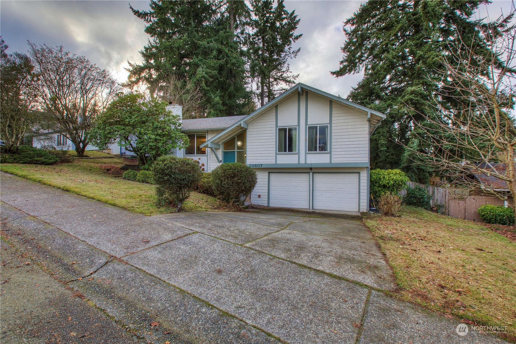32607 35th Avenue Southwest Federal Way, WA 98023 - Photo 24 of 24 front view of house with a yard and trees all around