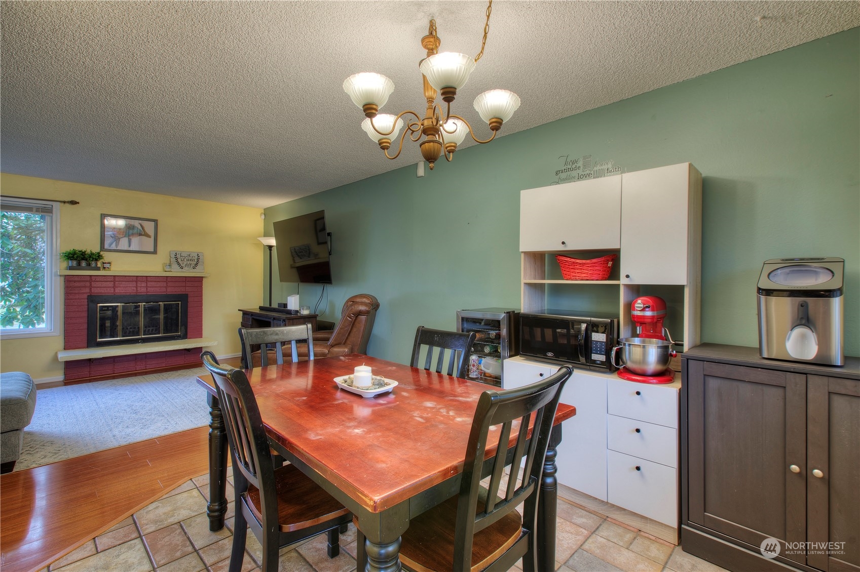 32607 35th Avenue Southwest Federal Way, WA 98023 - Photo 7 of 24 a view of a dining room with furniture and wooden floor