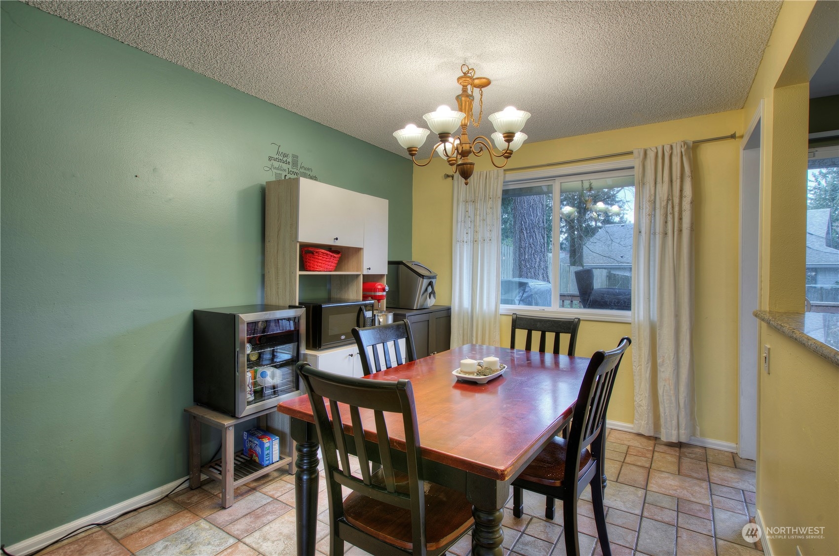 32607 35th Avenue Southwest Federal Way, WA 98023 - Photo 8 of 24 a view of a dining room with furniture and chandelier