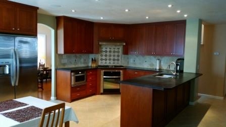 Large open Kitchen includes breakfast eating area, desk area and plenty of storage, open to spacious family room. Great for entertaining!
