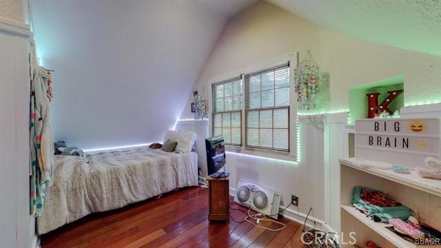 22013 Mojave River Road Cedarpines Park, CA 92322 - Photo 13 of 22 a bedroom with a bed and a window