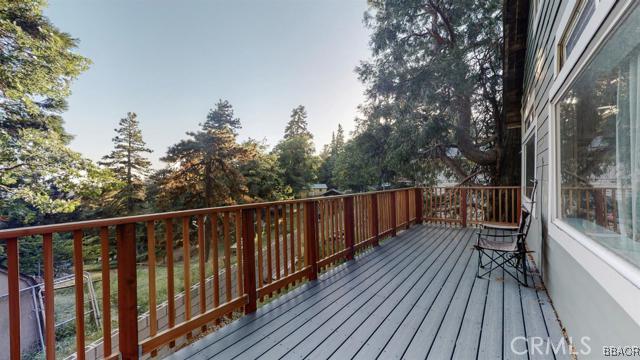 22013 Mojave River Road Cedarpines Park, CA 92322 - Photo 18 of 22 a balcony with wooden floor and outdoor seating