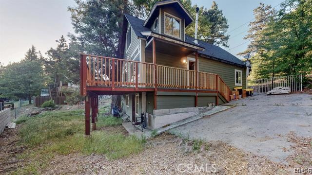 22013 Mojave River Road Cedarpines Park, CA 92322 - Photo 20 of 22 a view of wooden house with large trees and wooden fence