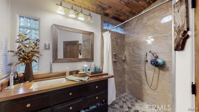 22013 Mojave River Road Cedarpines Park, CA 92322 - Photo 8 of 22 a bathroom with a double vanity sink mirror and shower