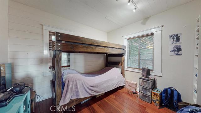 22013 Mojave River Road Cedarpines Park, CA 92322 - Photo 9 of 22 a bedroom with a bed and a mirror