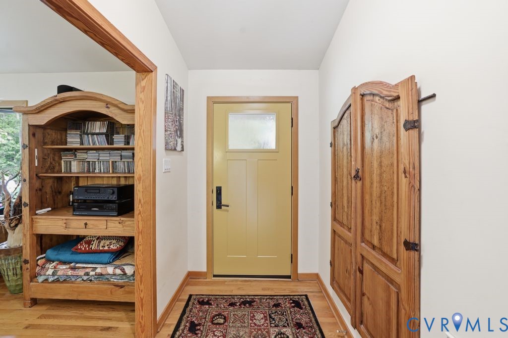 1061 Turkey Ridge Drive Moseley, VA 23120 - Photo 4 of 51 a view of a hallway with wooden floor and closet