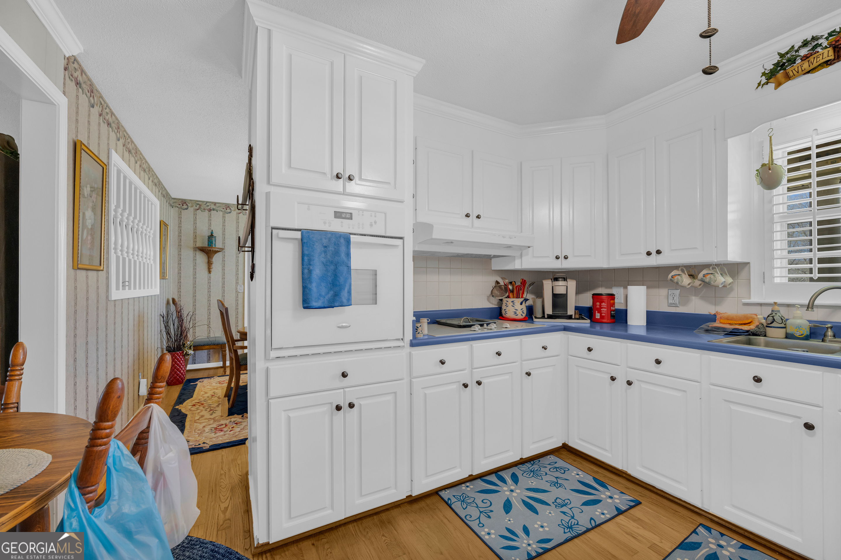 80 Riverbend Circle Royston, GA 30662 - Photo 14 of 70 a kitchen with stainless steel appliances white cabinets and a stove top oven