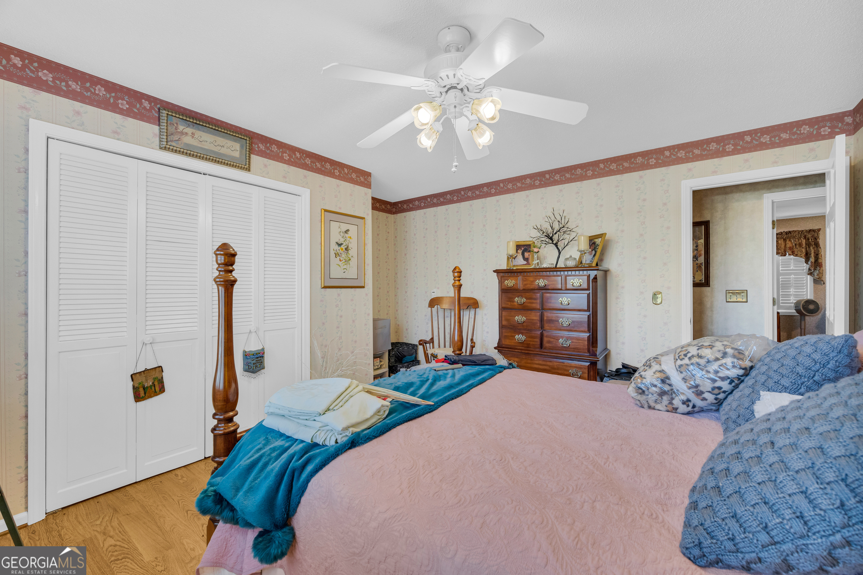 80 Riverbend Circle Royston, GA 30662 - Photo 25 of 70 a bedroom with a large bed and a chandelier