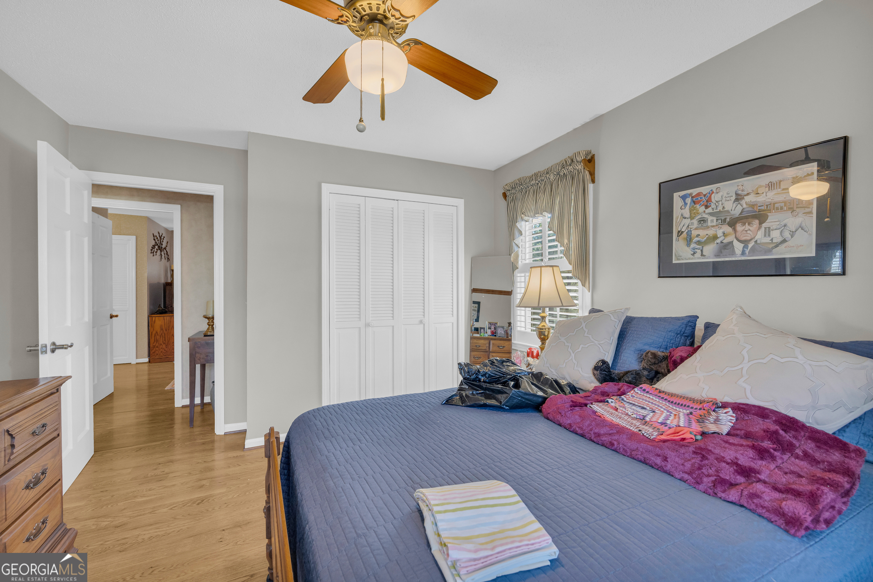 80 Riverbend Circle Royston, GA 30662 - Photo 27 of 70 a bedroom with a bed and a chandelier