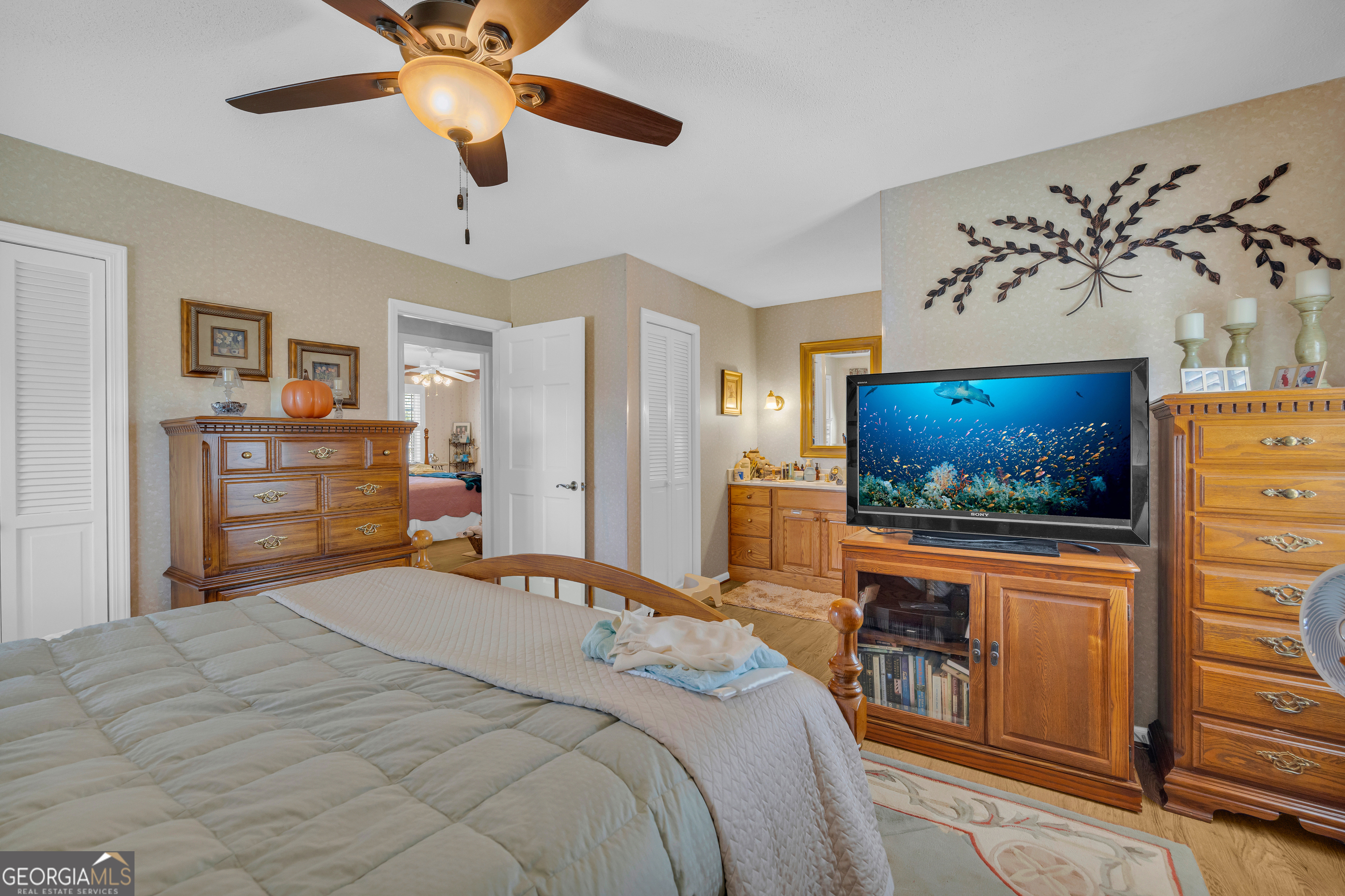 80 Riverbend Circle Royston, GA 30662 - Photo 30 of 70 a bedroom with a bed and a flat screen tv