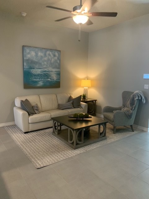 6737 Breeann Street Corpus Christi, TX 78413 - Photo 2 of 4 a living room with furniture and a chandelier
