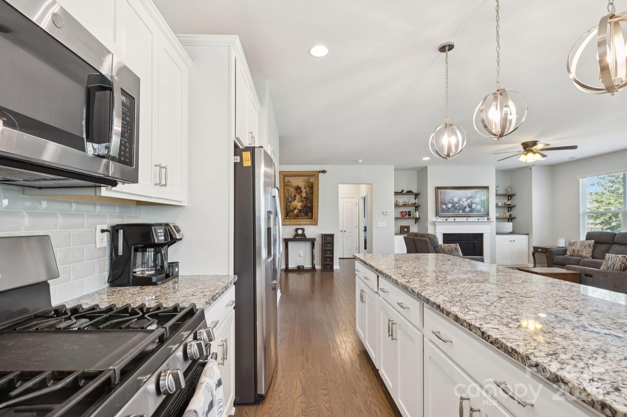 4236 Merrivale Drive Lancaster, SC 29720 - Photo 13 of 48 a kitchen with stainless steel appliances granite countertop a stove and cabinets