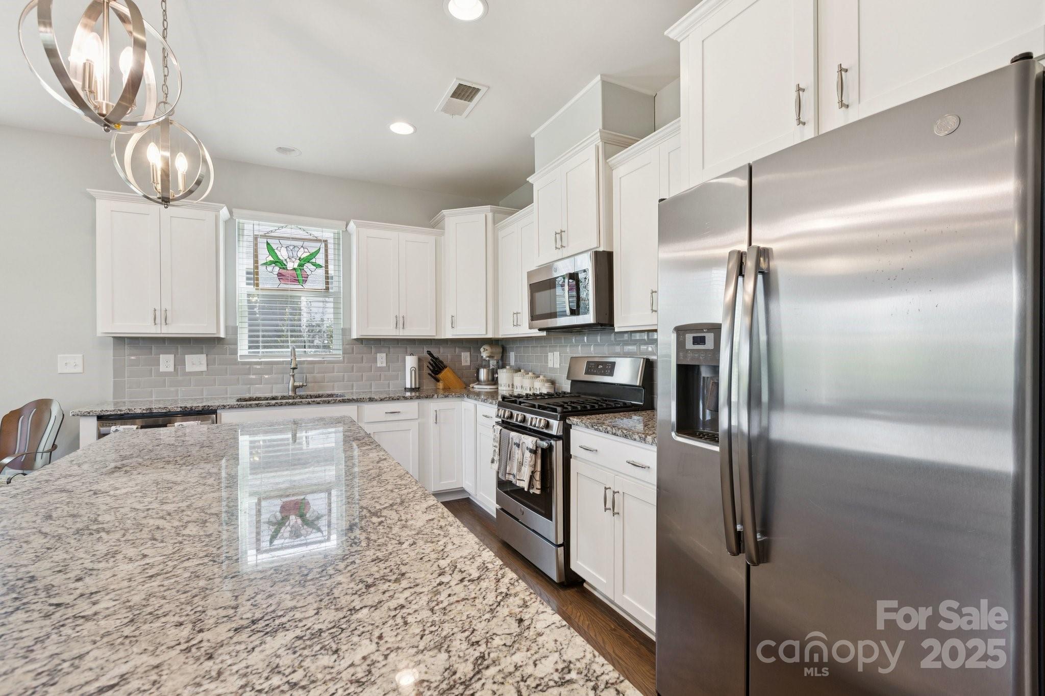 4236 Merrivale Drive Lancaster, SC 29720 - Photo 14 of 48 a kitchen with a refrigerator a sink and cabinets