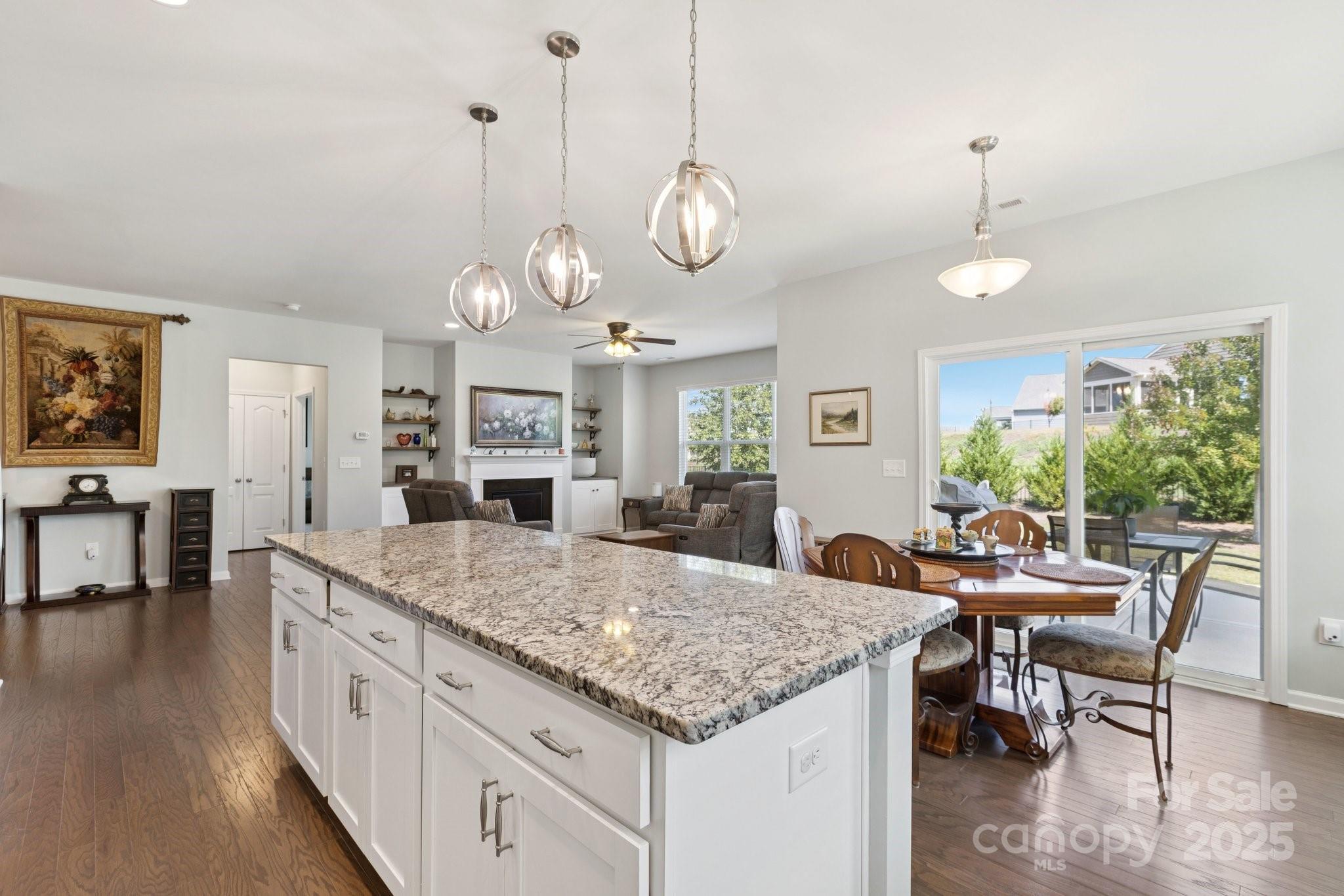 4236 Merrivale Drive Lancaster, SC 29720 - Photo 15 of 48 a view of a dining room and livingroom with furniture wooden floor a chandelier