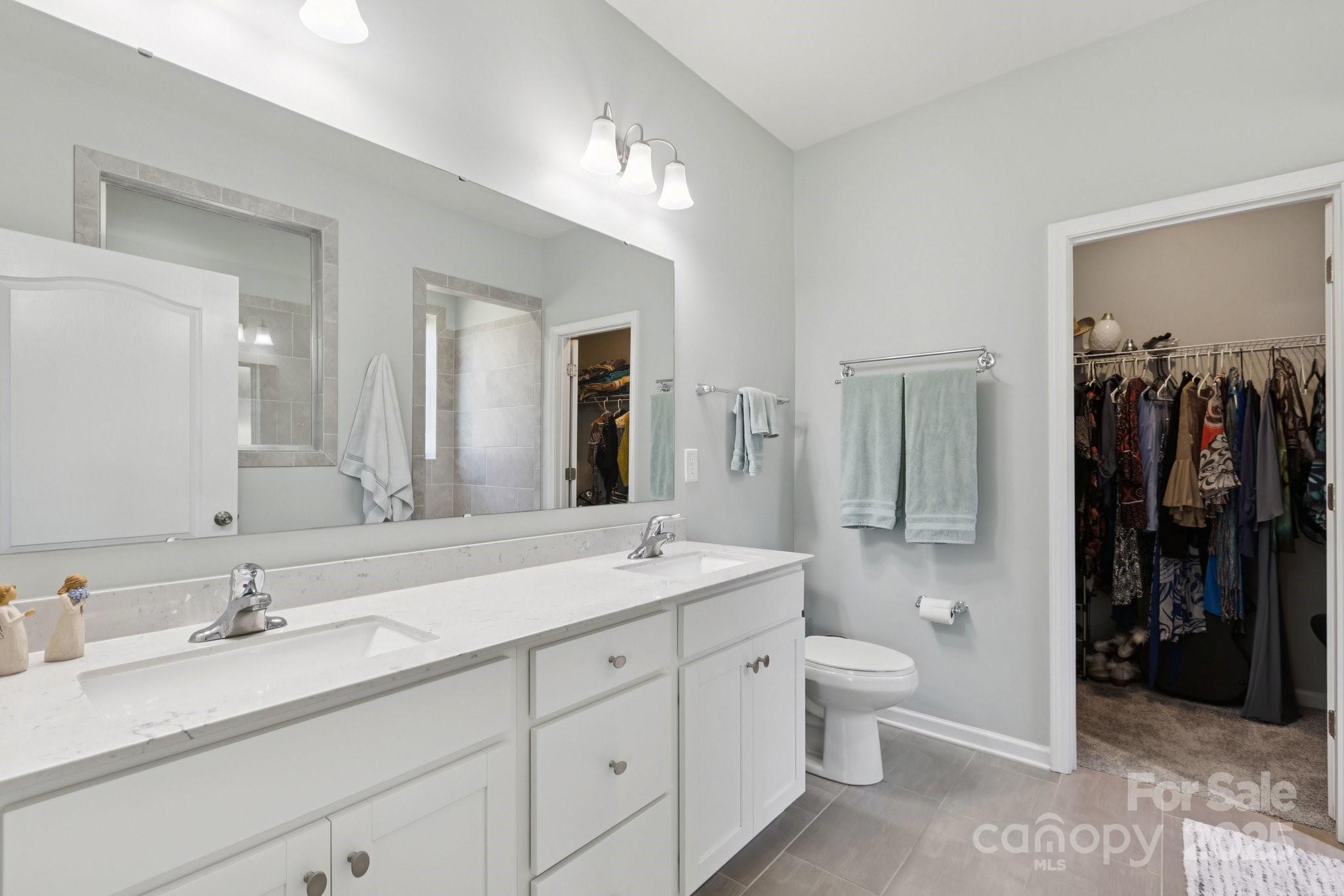 4236 Merrivale Drive Lancaster, SC 29720 - Photo 23 of 48 a spacious bathroom with a double vanity sink double mirror and toilet