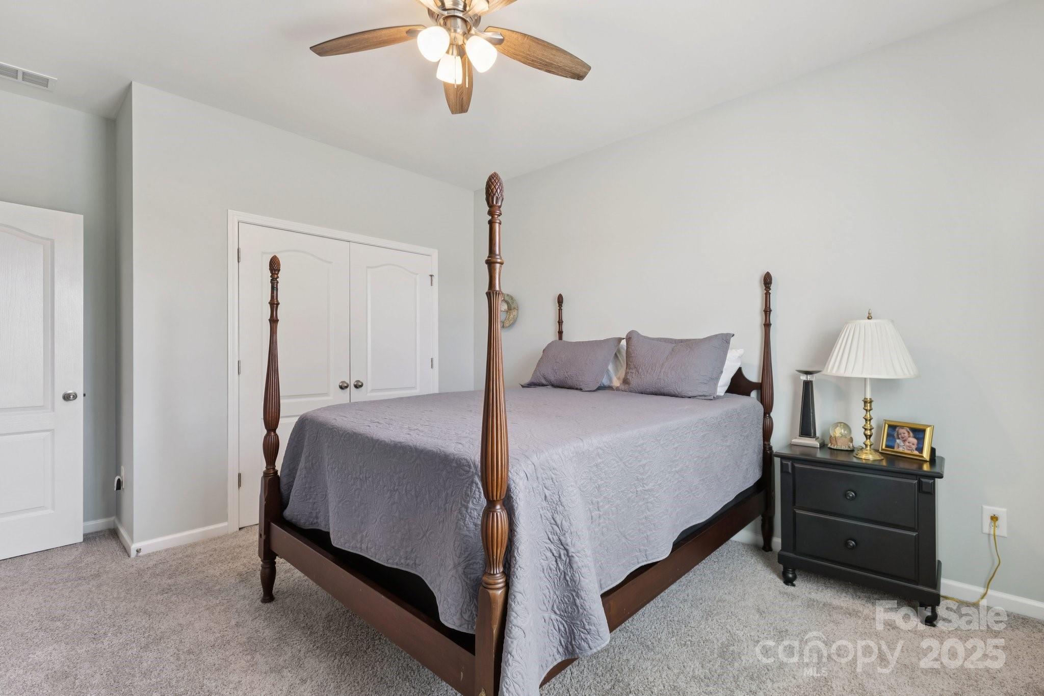 4236 Merrivale Drive Lancaster, SC 29720 - Photo 26 of 48 a bedroom with bed and a chandelier