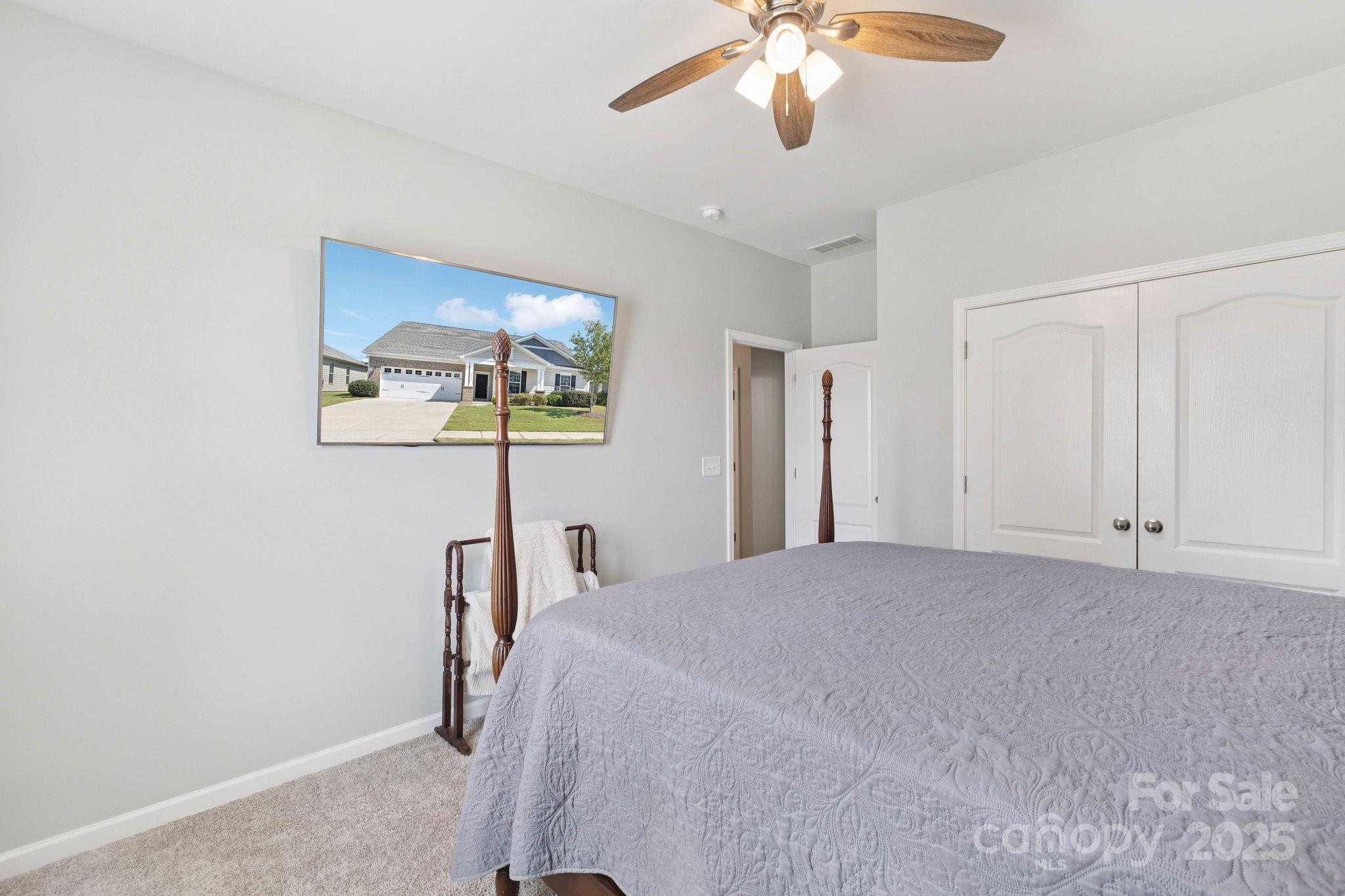 4236 Merrivale Drive Lancaster, SC 29720 - Photo 27 of 48 a bedroom with a bed and a chandelier