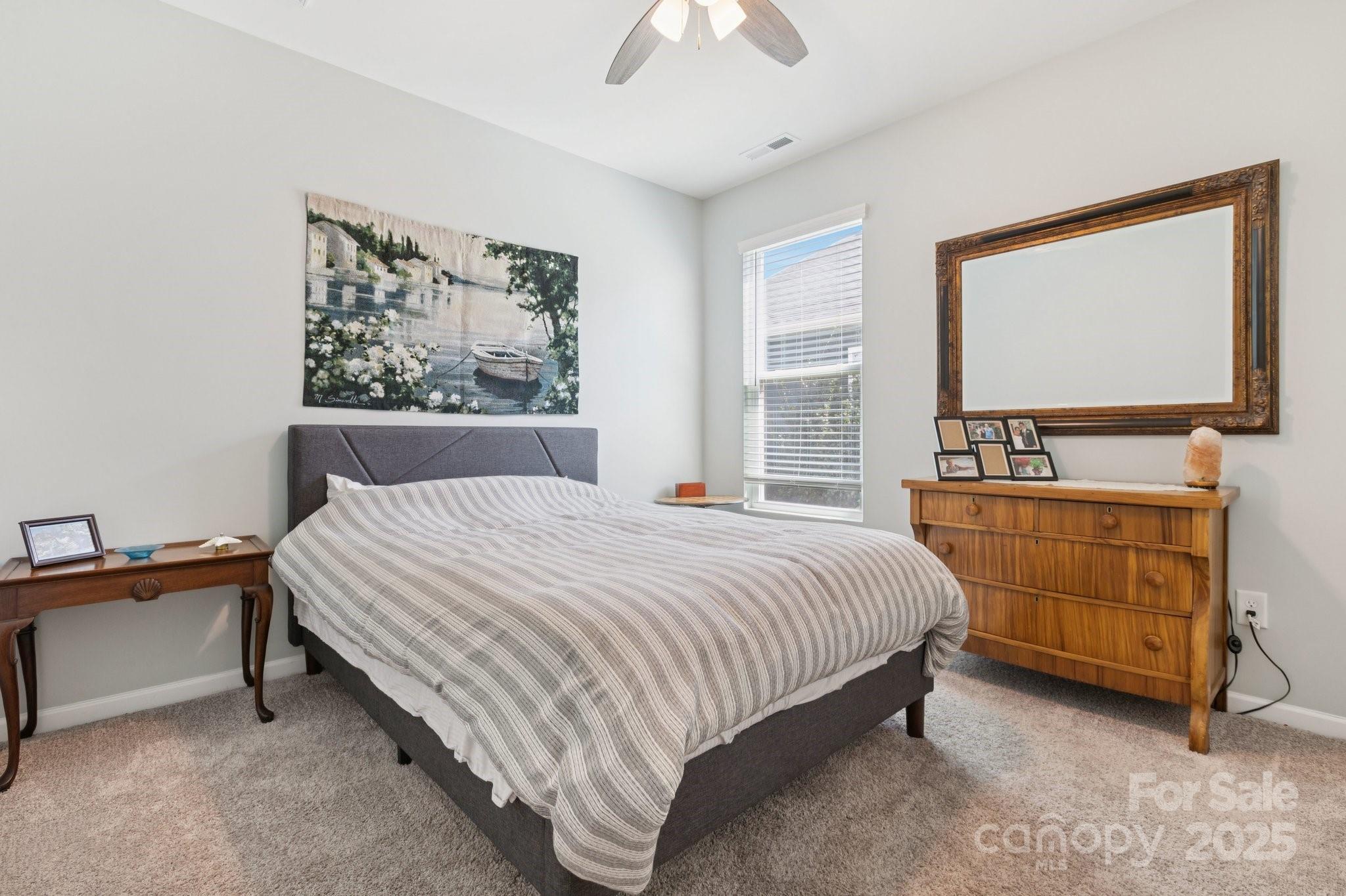4236 Merrivale Drive Lancaster, SC 29720 - Photo 31 of 48 a bedroom with a bed a dresser and next to a window