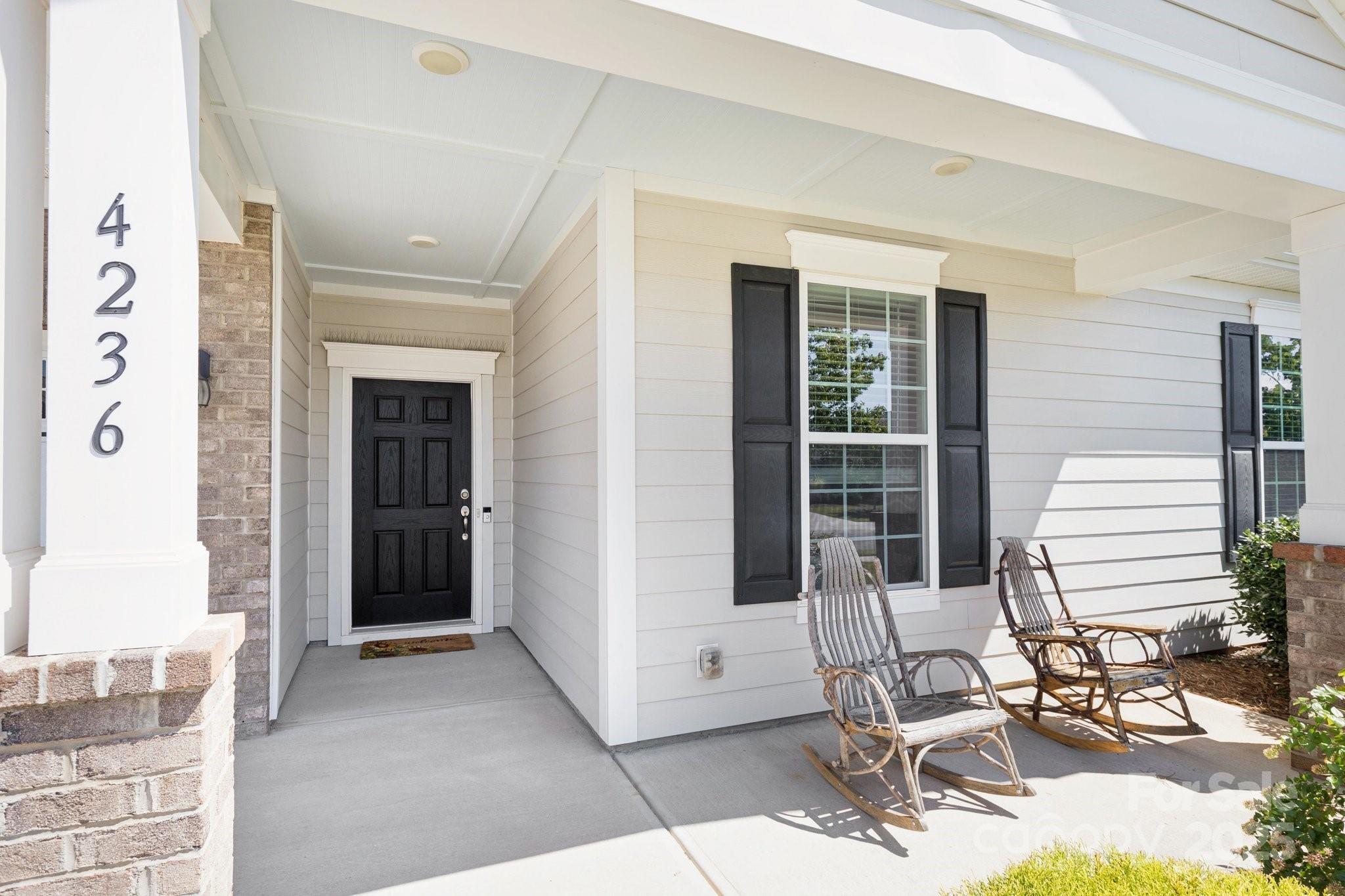 4236 Merrivale Drive Lancaster, SC 29720 - Photo 7 of 48 a building outdoor space with patio furniture and potted plants