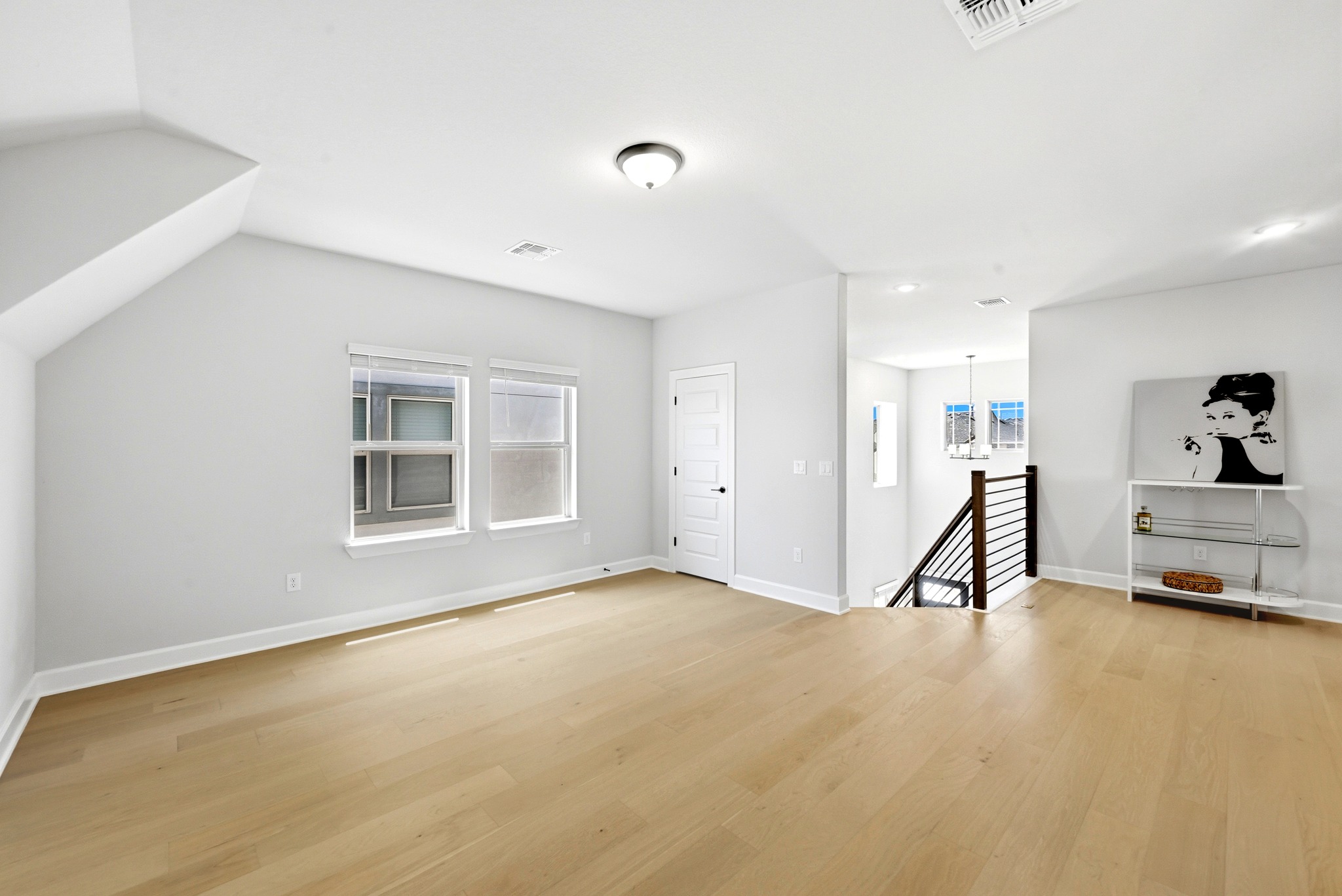 2702 Sebring Circle Austin, TX 78747 - Photo 19 of 35 Clean lines and light wood flooring define this versatile upper-level living space.