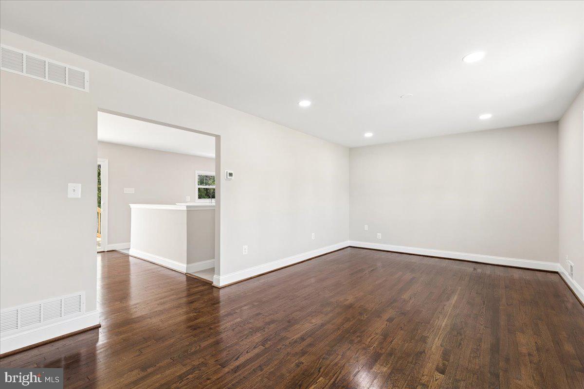 216 Cheddington Road Linthicum Heights, MD 21090 - Photo 11 of 60 a view of a livingroom with wooden floor