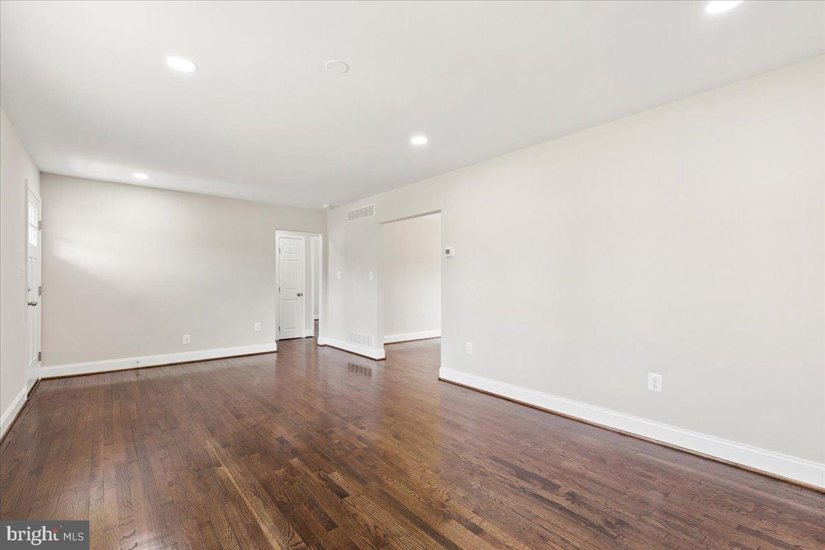 216 Cheddington Road Linthicum Heights, MD 21090 - Photo 12 of 60 a view of an empty room with wooden floor