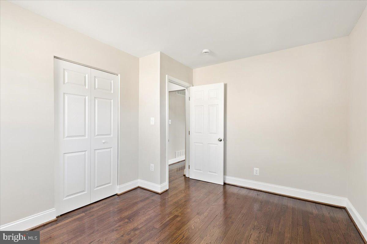 216 Cheddington Road Linthicum Heights, MD 21090 - Photo 17 of 60 a view of an empty room with wooden floor